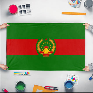 A mockup of the custom flag 'Socialist Bolivia Flag' held up on a table during print checking