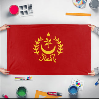 A mockup of the custom flag 'Socialist Pakistan Flag' held up on a table during print checking