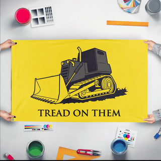 A mockup of the custom flag 'Killdozer Tread On Them Flag' held up on a table during print checking