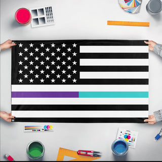 A mockup of the custom flag 'Thin Teal Line Flag' held up on a table during print checking