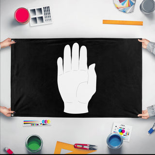 A mockup of the custom flag 'Flag of Isengard flag' held up on a table during print checking