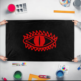 A mockup of the custom flag 'Flag of Mordor flag' held up on a table during print checking