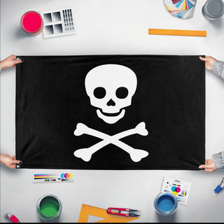 A mockup of the custom flag 'Jolly Roger Flag' held up on a table during print checking