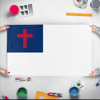 A mockup of the custom flag 'Christianity Flag' held up on a table during print checking