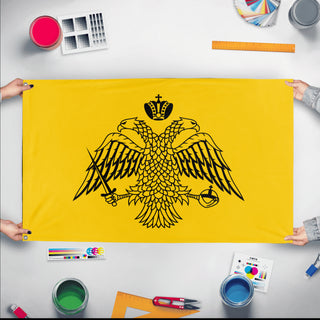 A mockup of the custom flag 'Orthodox Flag' held up on a table during print checking