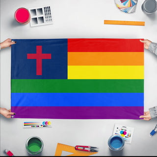 A mockup of the custom flag 'Christian Pride Flag' held up on a table during print checking