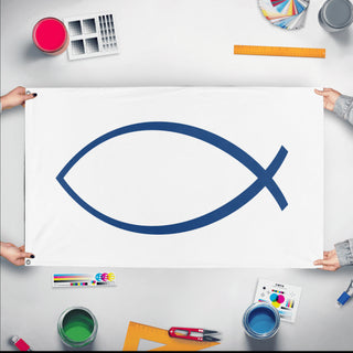 A mockup of the custom flag 'Christian Jesus Fish Flag' held up on a table during print checking