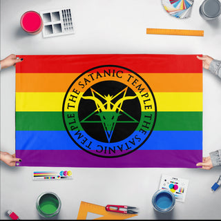 A mockup of the custom flag 'Satanic Pride Flag' held up on a table during print checking