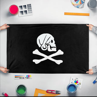 A mockup of the custom flag 'King of the Pirates Flag' held up on a table during print checking