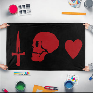 A mockup of the custom flag 'Caribbean Pirates Flag' held up on a table during print checking