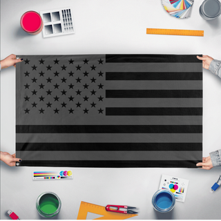 A mockup of the custom flag 'No Quarter Flag' held up on a table during print checking