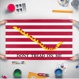 A mockup of the custom flag 'First Navy Jack Flag' held up on a table during print checking