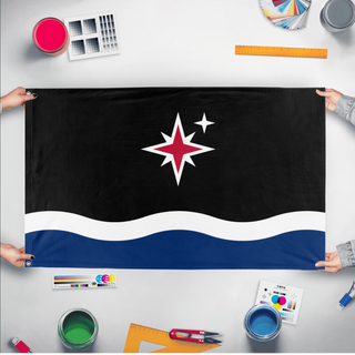 A mockup of the custom flag 'Grand Union of Grand Manan flag' held up on a table during print checking