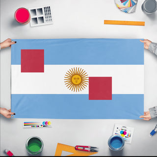 A mockup of the custom flag 'T flag' held up on a table during print checking