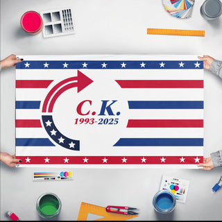 A mockup of the custom flag 'Turning Point Charlie Kirk flag' held up on a table during print checking