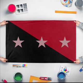A mockup of the custom flag 'Tonopah Peoples Republic flag' held up on a table during print checking
