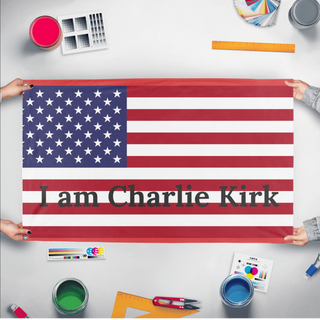 A mockup of the custom flag 'Charlie Kirk USA flag' held up on a table during print checking