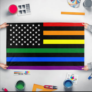 A mockup of the custom flag 'US Rainbow Pride Flag' held up on a table during print checking