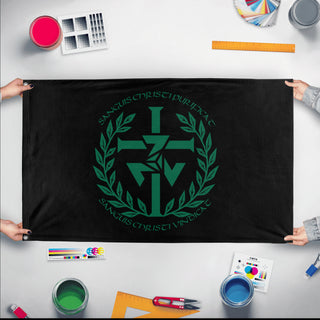 A mockup of the custom flag 'Sanguis Christi Triskelie flag' held up on a table during print checking