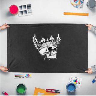 A mockup of the custom flag 'idas flag' held up on a table during print checking