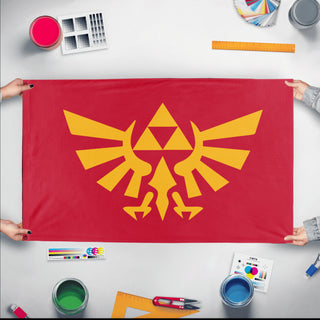A mockup of the custom flag 'Hyrule flag' held up on a table during print checking
