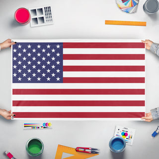 A mockup of the custom flag 'Test 2 flag' held up on a table during print checking