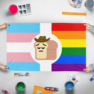 A mockup of the custom flag 'PensivePrideCowboyBread flag' held up on a table during print checking