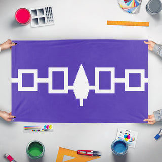 A mockup of the custom flag 'Iroquois Confederacy Flag' held up on a table during print checking