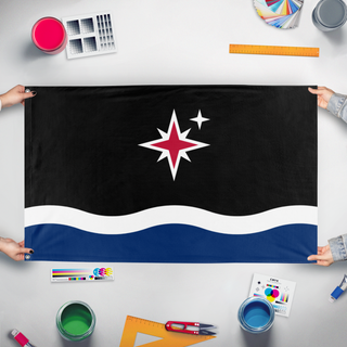A mockup of the custom flag 'Grand Union of Grand Manan flag' held up on a table during print checking