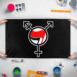 A mockup of the custom flag 'TRANSTIFA flag' held up on a table during print checking