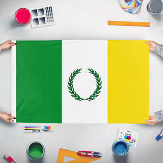 A mockup of the custom flag 'Timbio flag' held up on a table during print checking