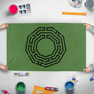 A mockup of the custom flag 'Ghorman Protester Flag' held up on a table during print checking