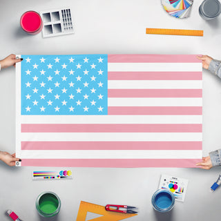 A mockup of the custom flag 'Trans American Flag' held up on a table during print checking