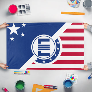 A mockup of the custom flag 'Enclave flag' held up on a table during print checking