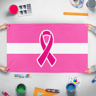 A mockup of the custom flag 'Latvian Breast Cancer Awareness flag' held up on a table during print checking