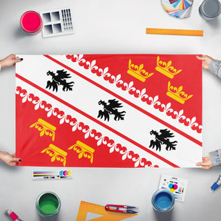 A mockup of the custom flag 'Elsass-Mosel flag' held up on a table during print checking