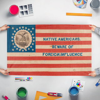 A mockup of the custom flag 'Know Nothing flag' held up on a table during print checking
