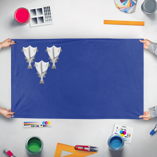 A mockup of the custom flag 'Revolutionary Iceland flag' held up on a table during print checking