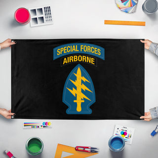A mockup of the custom flag 'Airborne Special Forces flag' held up on a table during print checking
