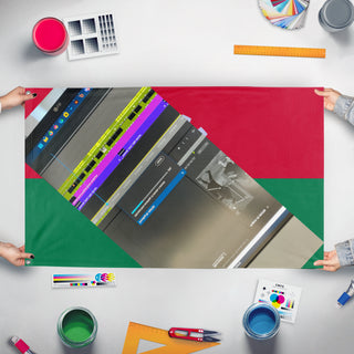 A mockup of the custom flag 'T flag' held up on a table during print checking