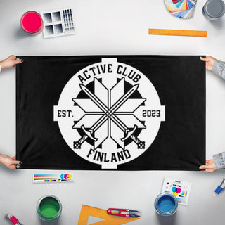 A mockup of the custom flag 'ACF flag' held up on a table during print checking