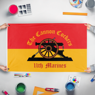 A mockup of the custom flag 'CannonCocker_9_24_25 flag' held up on a table during print checking