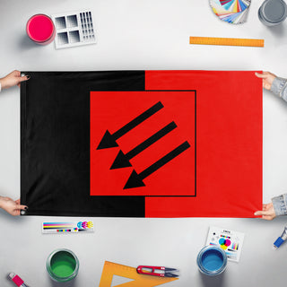 A mockup of the custom flag 'Eiserne Front' held up on a table during print checking
