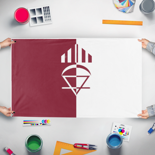A mockup of the custom flag 'Thing flag' held up on a table during print checking