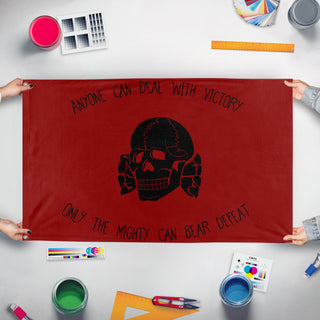 A mockup of the custom flag 'memeskullreenactment  flag' held up on a table during print checking