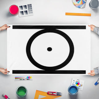 A mockup of the custom flag 'CircumPunct flag' held up on a table during print checking