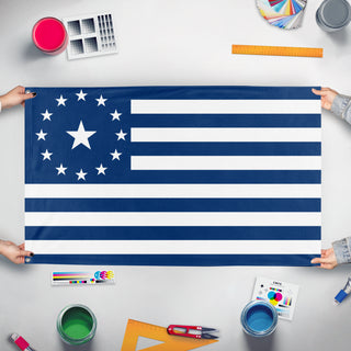 A mockup of the custom flag 'Kingdom of Deseret Flag' held up on a table during print checking