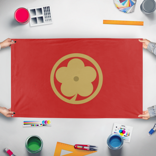 A mockup of the custom flag 'Montenegrin Flower flag' held up on a table during print checking