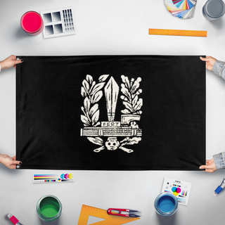 A mockup of the custom flag 'blackshirt flag' held up on a table during print checking