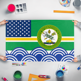 A mockup of the custom flag 'American State of Vancouver Island  flag' held up on a table during print checking